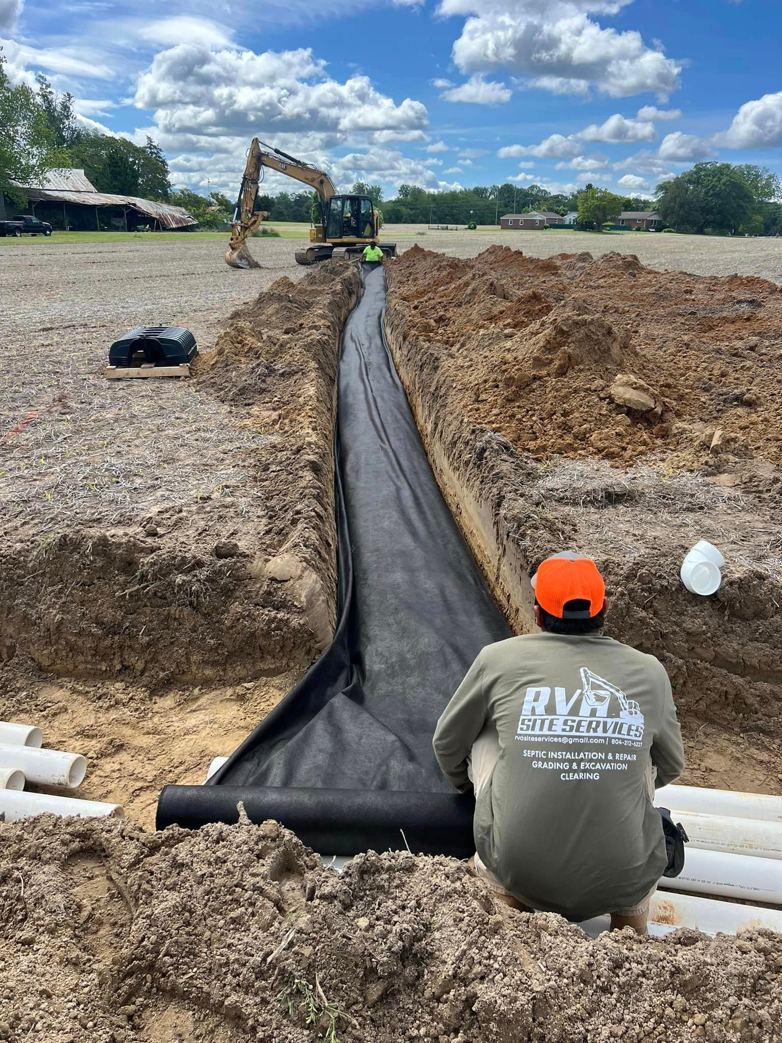 RVA Site Services with an excavator working on a septic tank installation in Richmond, VA