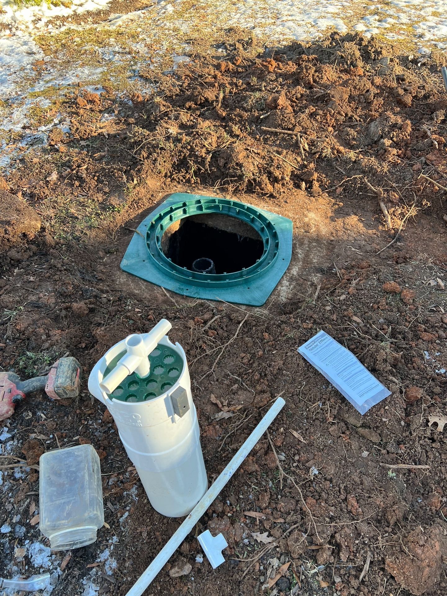 RVA Site Services repairing a septic pump inside a septic tank.