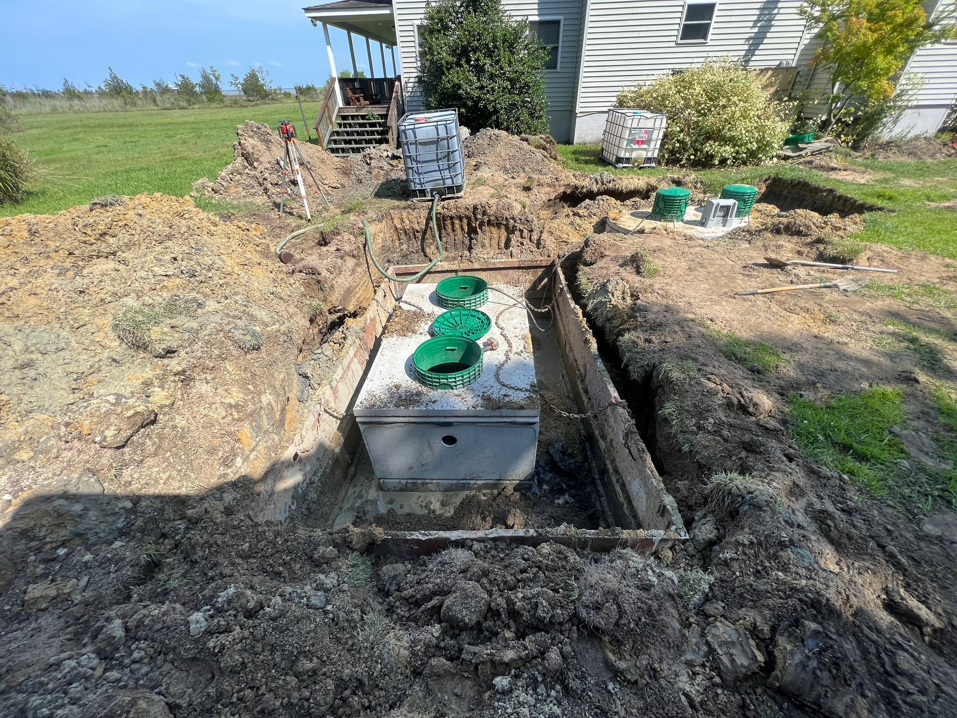 Septic contractor working on a residential septic system in Central Virginia