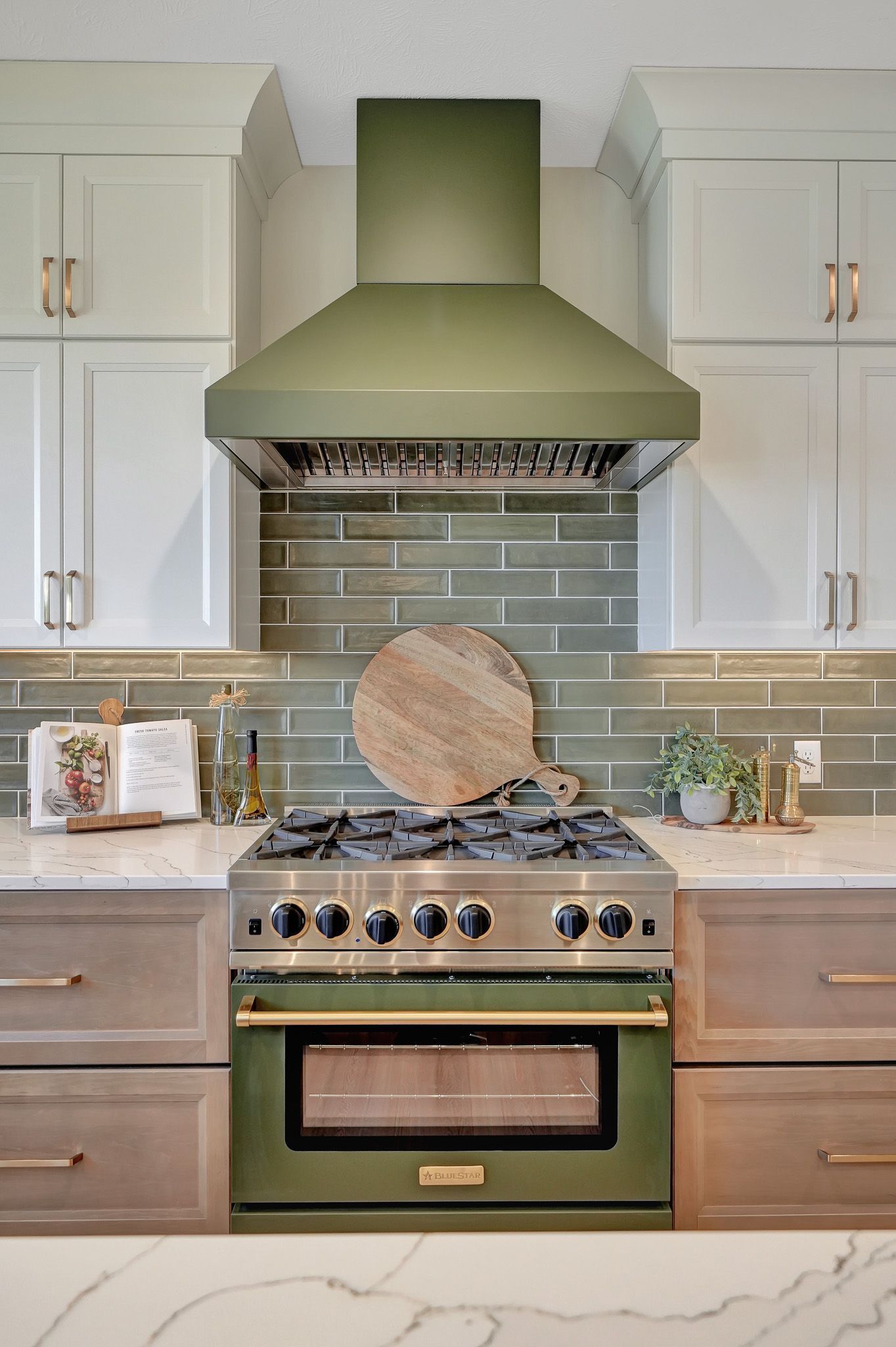 Bluestar Range from Gotcha Covered Green Range in an Open Concept Kitchen