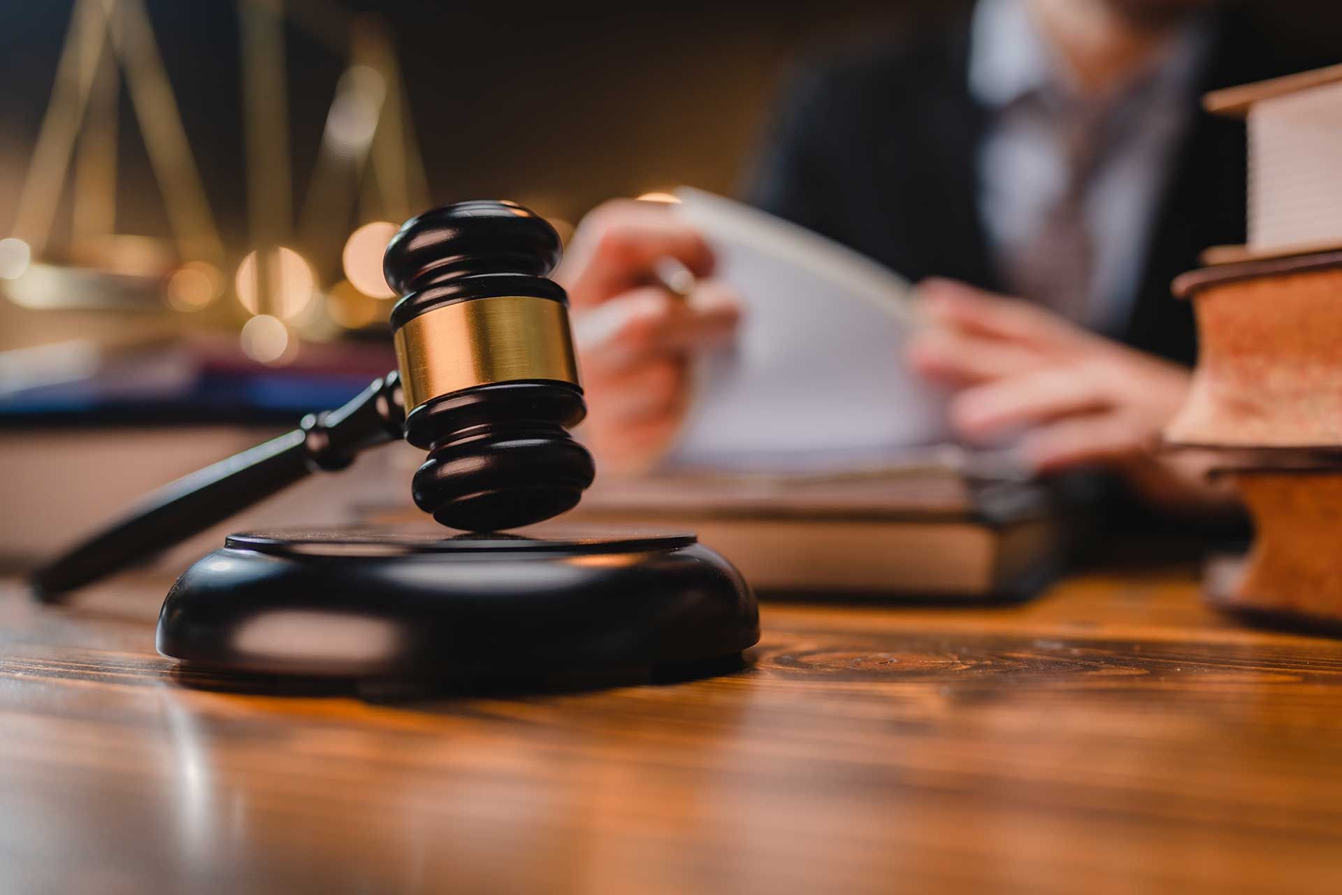 Local Attorney Reviewing Documents at Desk in Greenville, NC Region