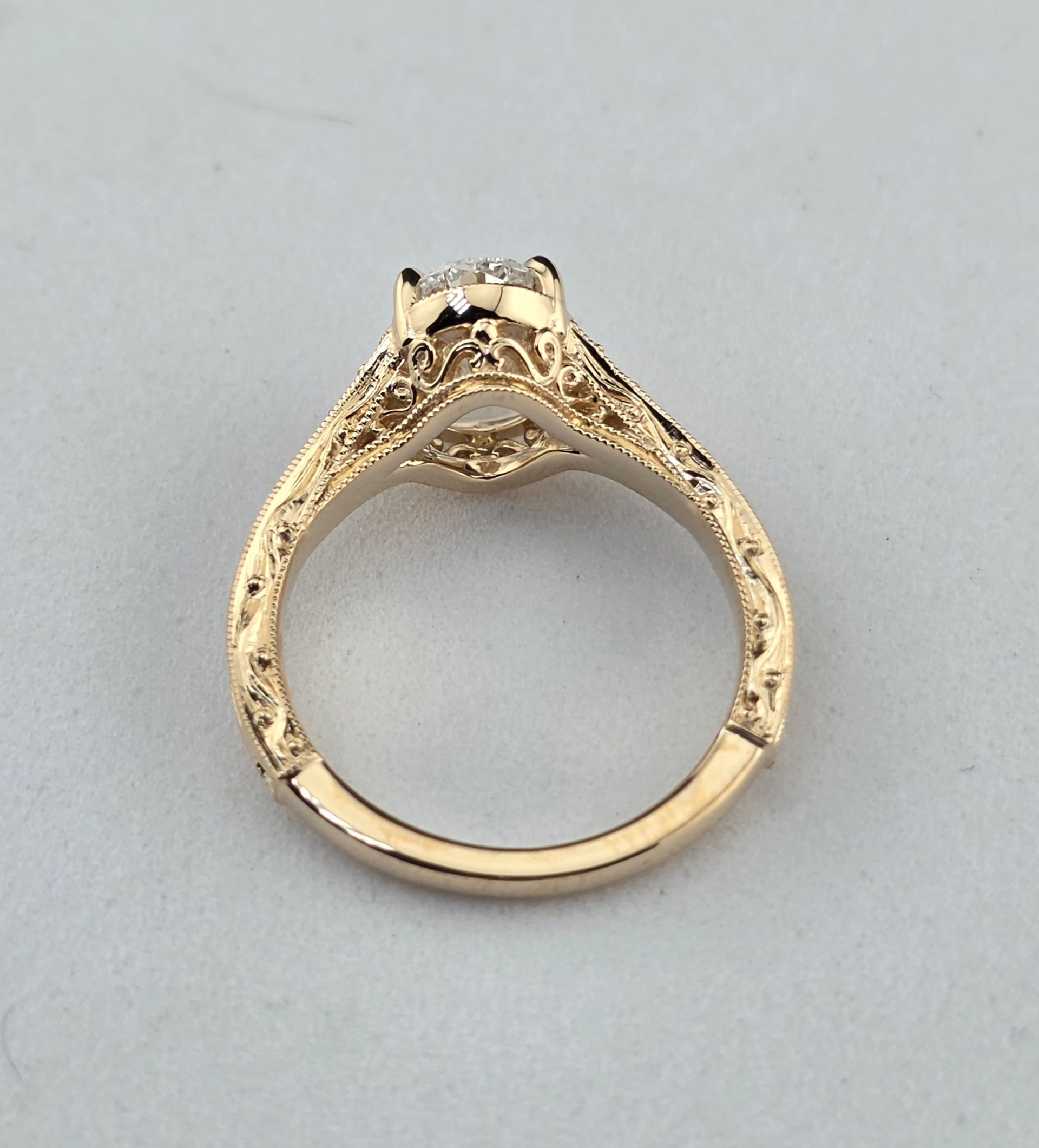 Vintage Gold ring with a diamonds  viewed from the side on a light background