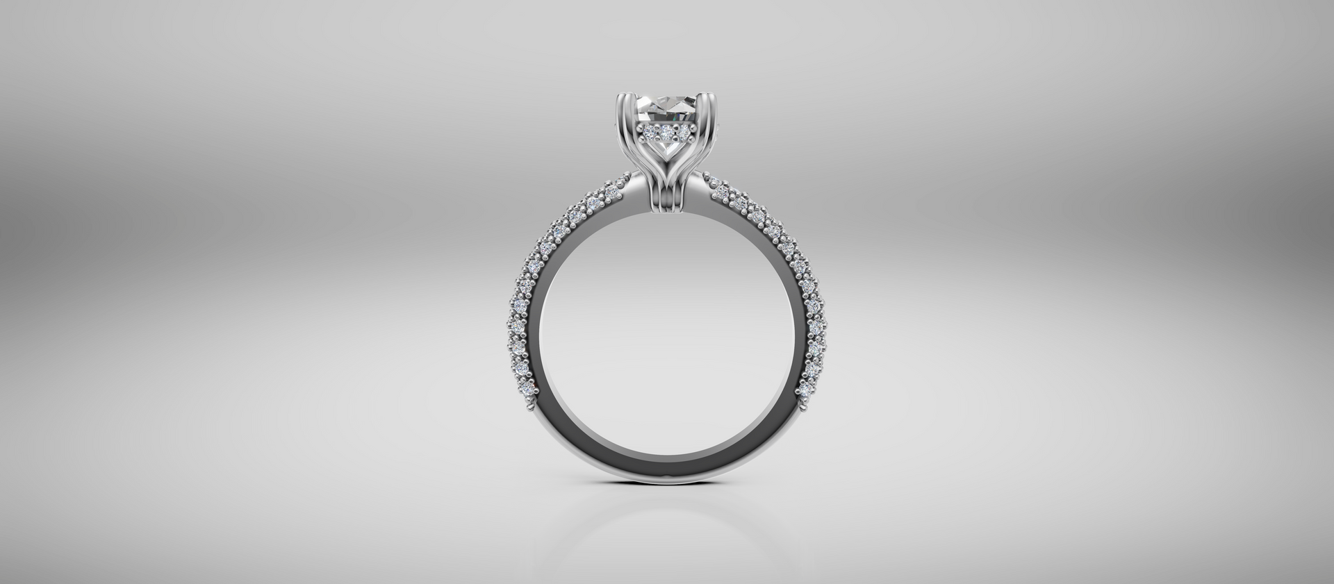 Silver engagement ring with a diamond solitaire on a light gray background