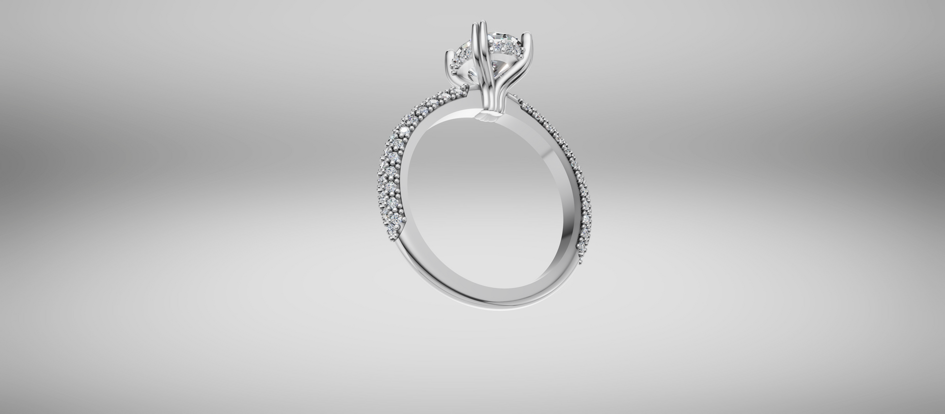 Silver ring with a butterfly-shaped setting on a light gray background