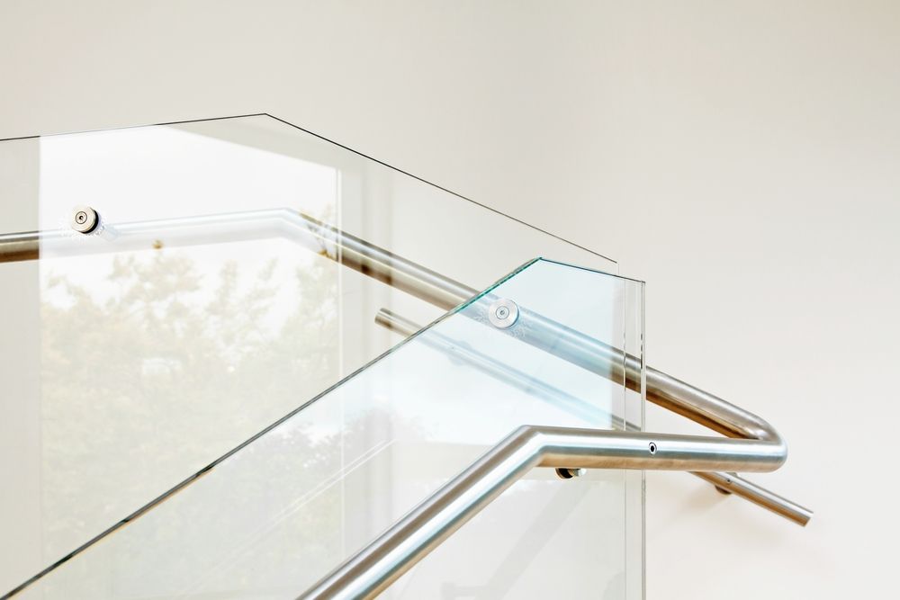 A Living Room With A Couch And A Large Window — All About Glass Lake Macquarie In Ellalong, NSW