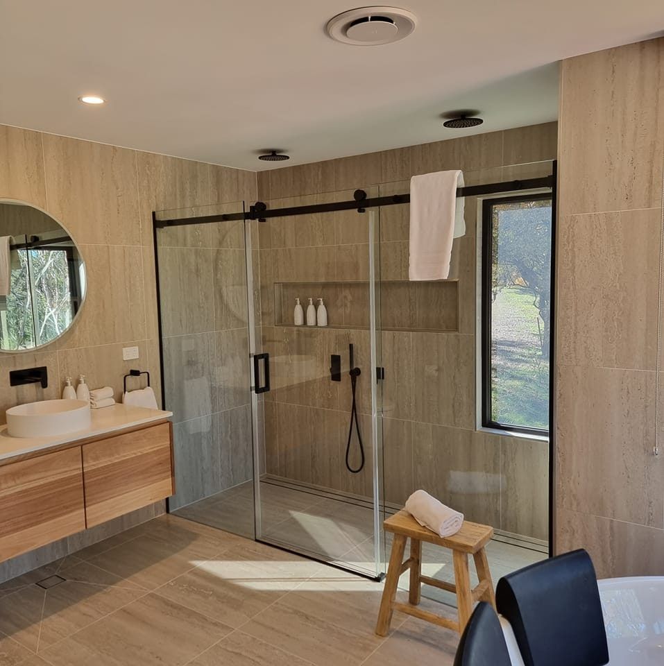 A Bathroom With A Walk In Shower, Sink, Mirror And Tub — All About Glass Lake Macquarie In Ellalong, NSW