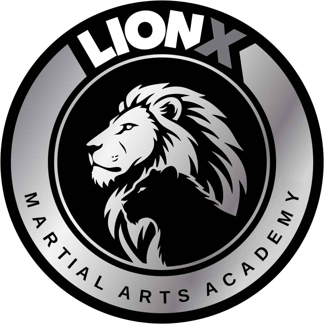 LionX Martial Arts Academy logo with white lion head on black and silver circular emblem