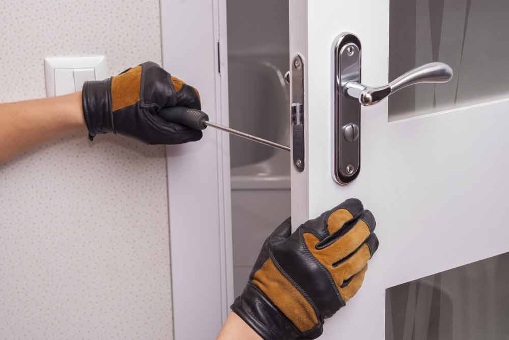 Locksmith Doing Door Lock And Handle Repair — Coast 2 Coast Locksmiths in Buderim, QLD