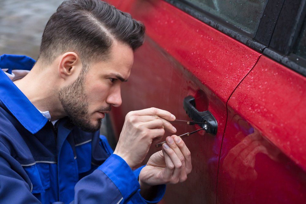 Man Opening Red Car Door — Coast 2 Coast Locksmiths in Buderim, QLD