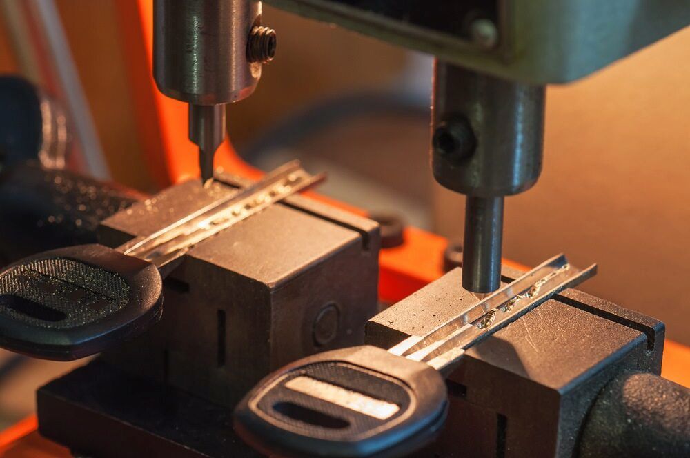 Key Cutting Machine in Use, Duplicating Car Keys — Coast 2 Coast Locksmiths in Aura, QLD