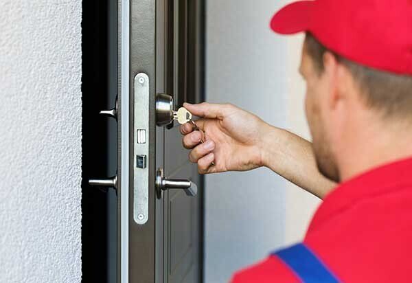 Man Repairing Door Lock — Coast 2 Coast Locksmiths in Buderim, QLD