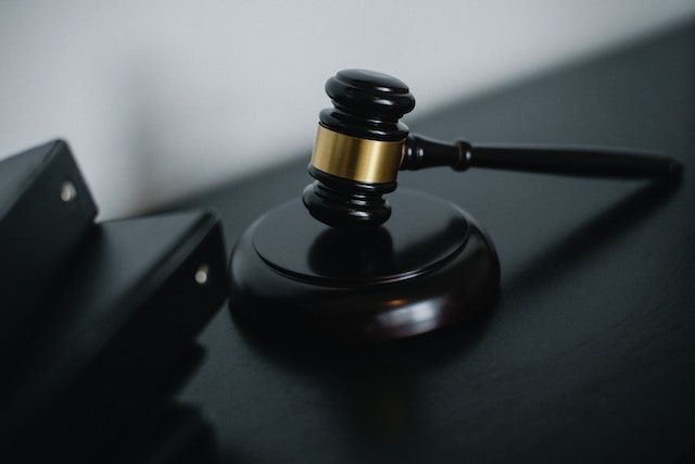 Black gavel on a black table