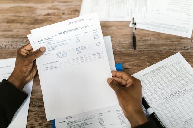 hands holding banking documents