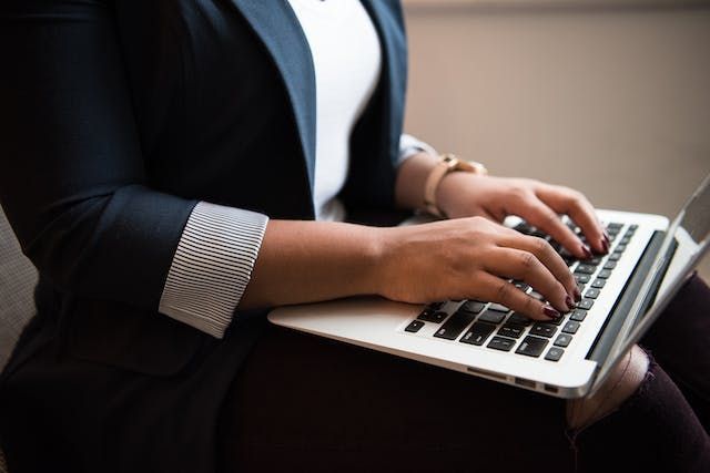 someone typing a computer