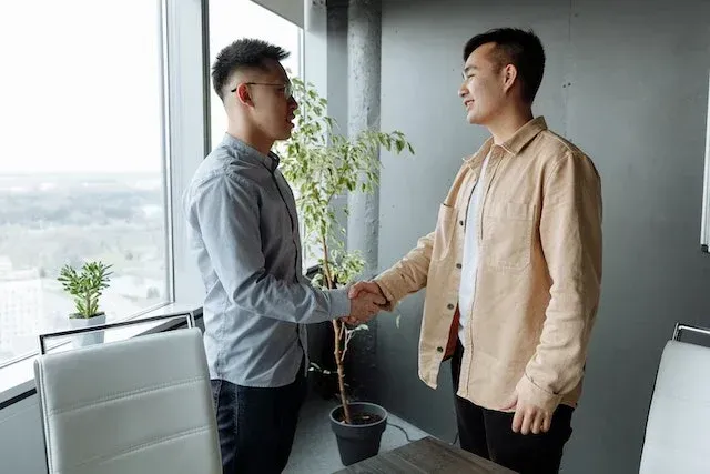 two people shaking hands