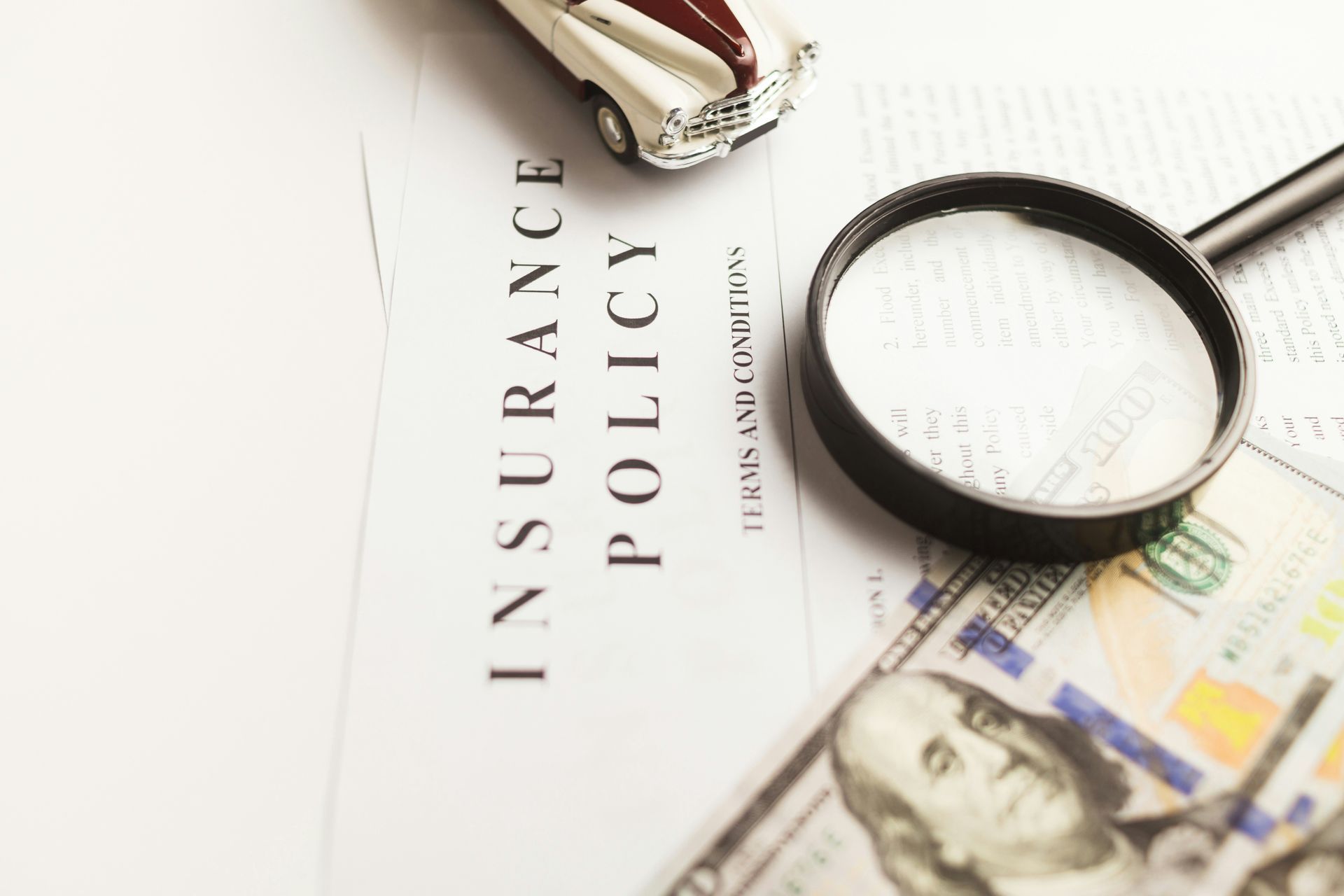 insurance policy with magnifying glass