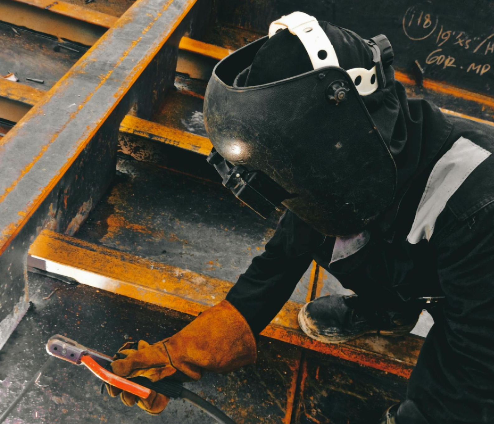 person welding steel