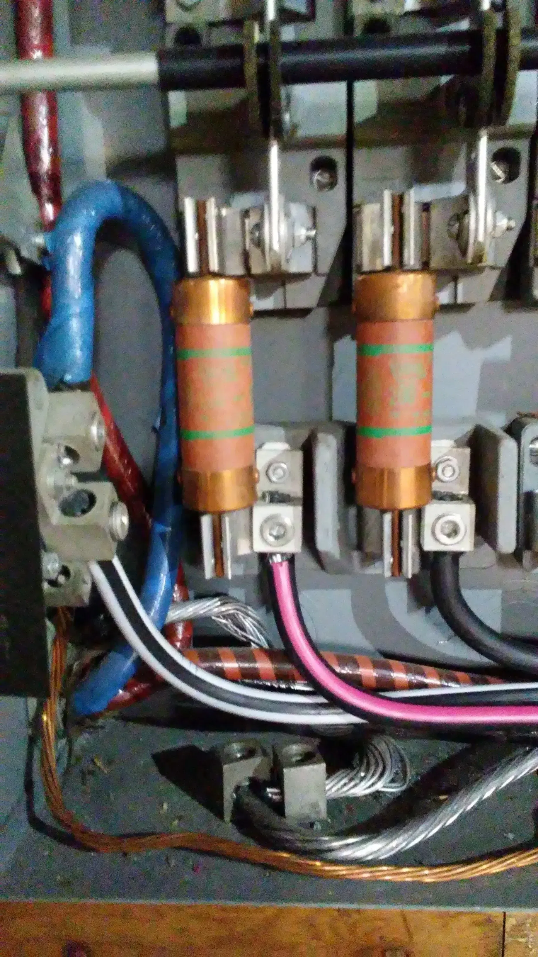 Close-up of copper electrical coils and wiring inside a machine housing