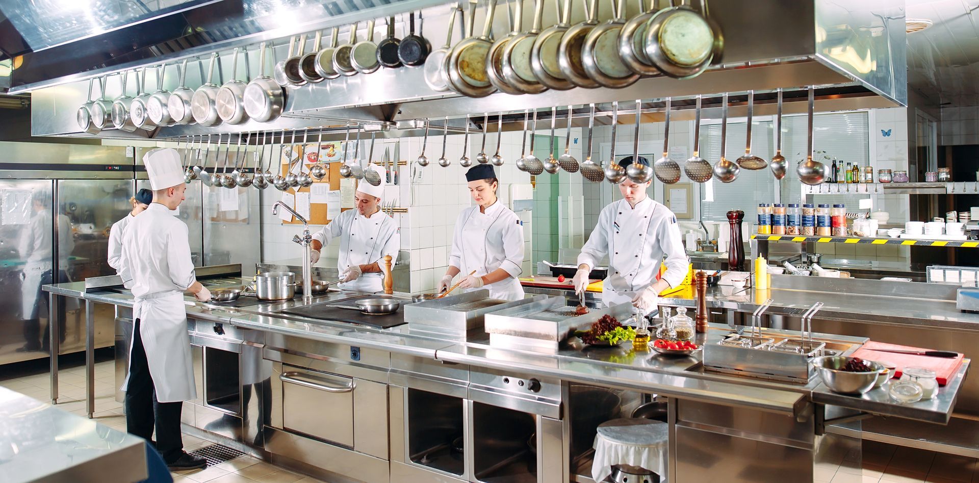 cooks cooking in hotel kitchen