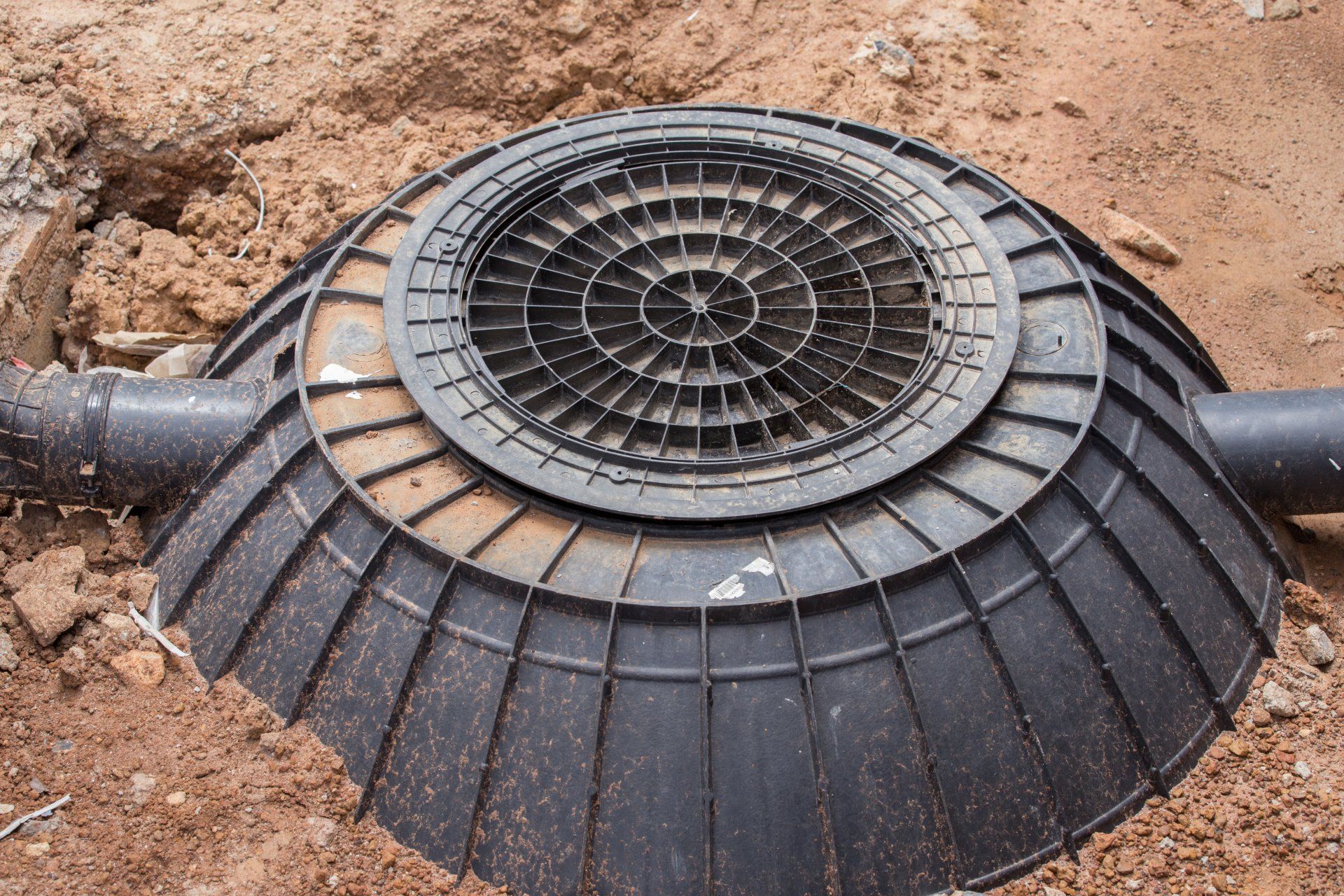 top of black septic tank in the ground