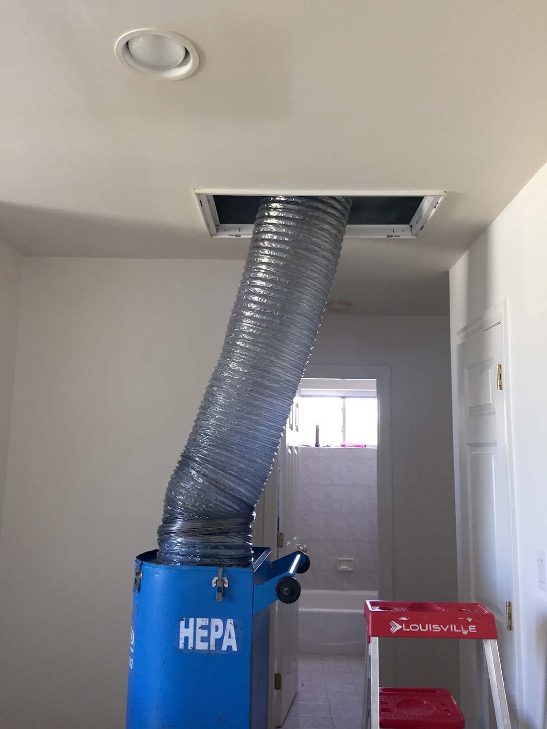 Cleaning a residential HVAC air duct system on Long Island. 