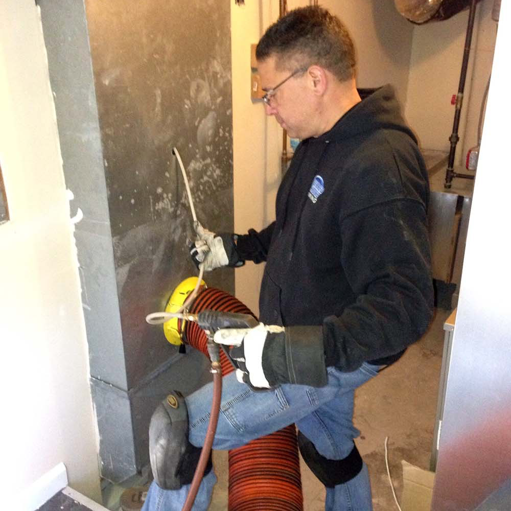 Cleaning air ducts at a Long Island home

