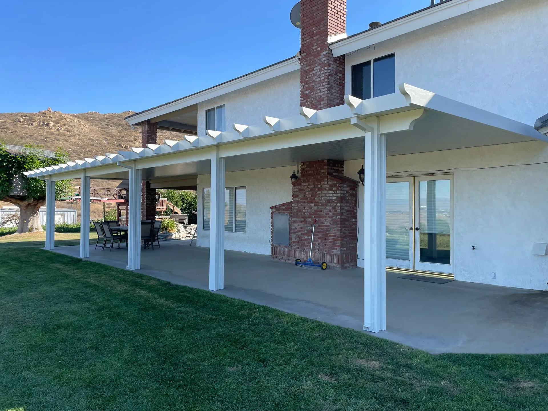 Beautiful aluminum solid patio cover with the traditional tails look in Menifee, CA.