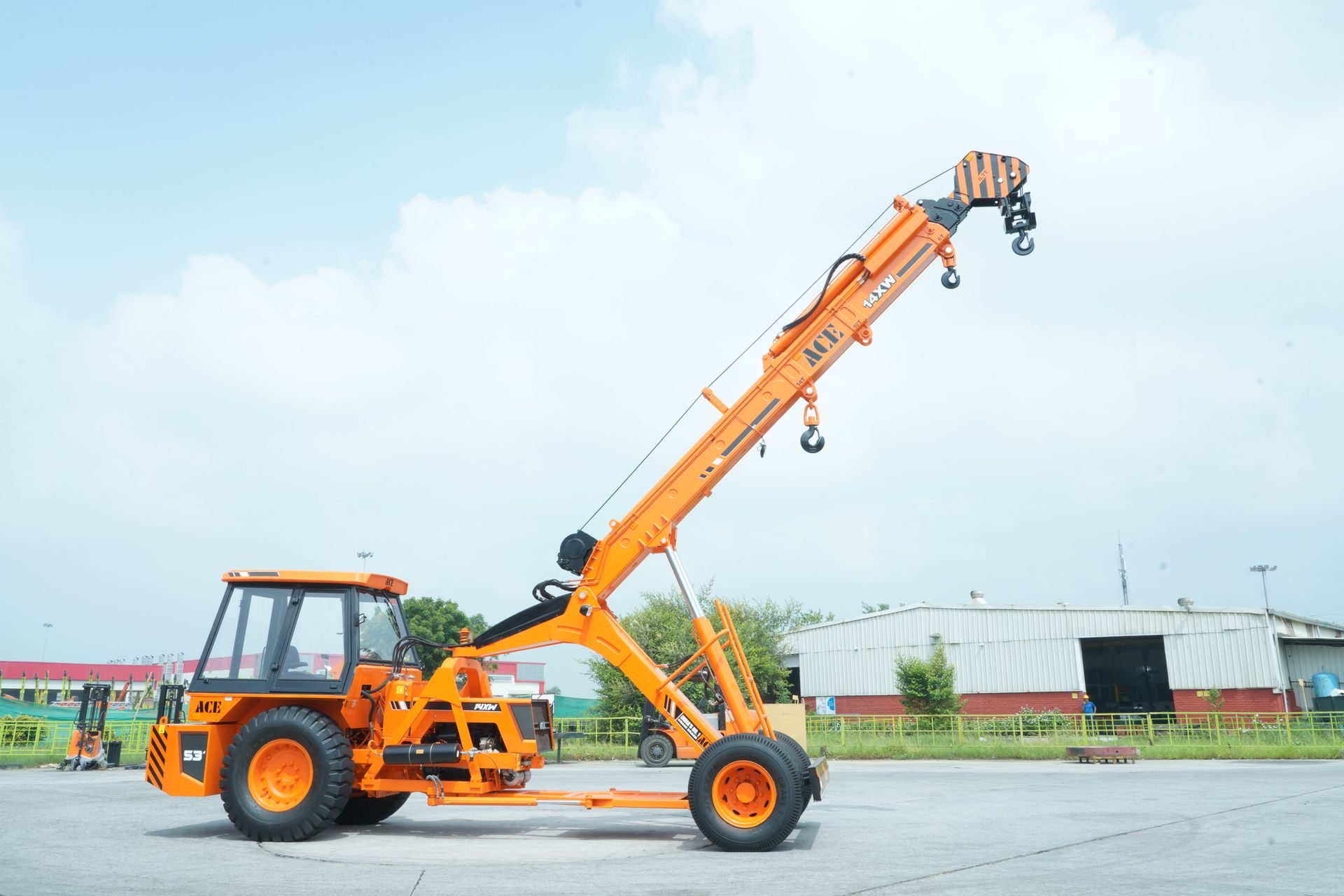 A boom truck parked and ready to go for crane service.