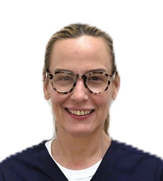 Portrait of a smiling person wearing glasses and a navy top against a white background