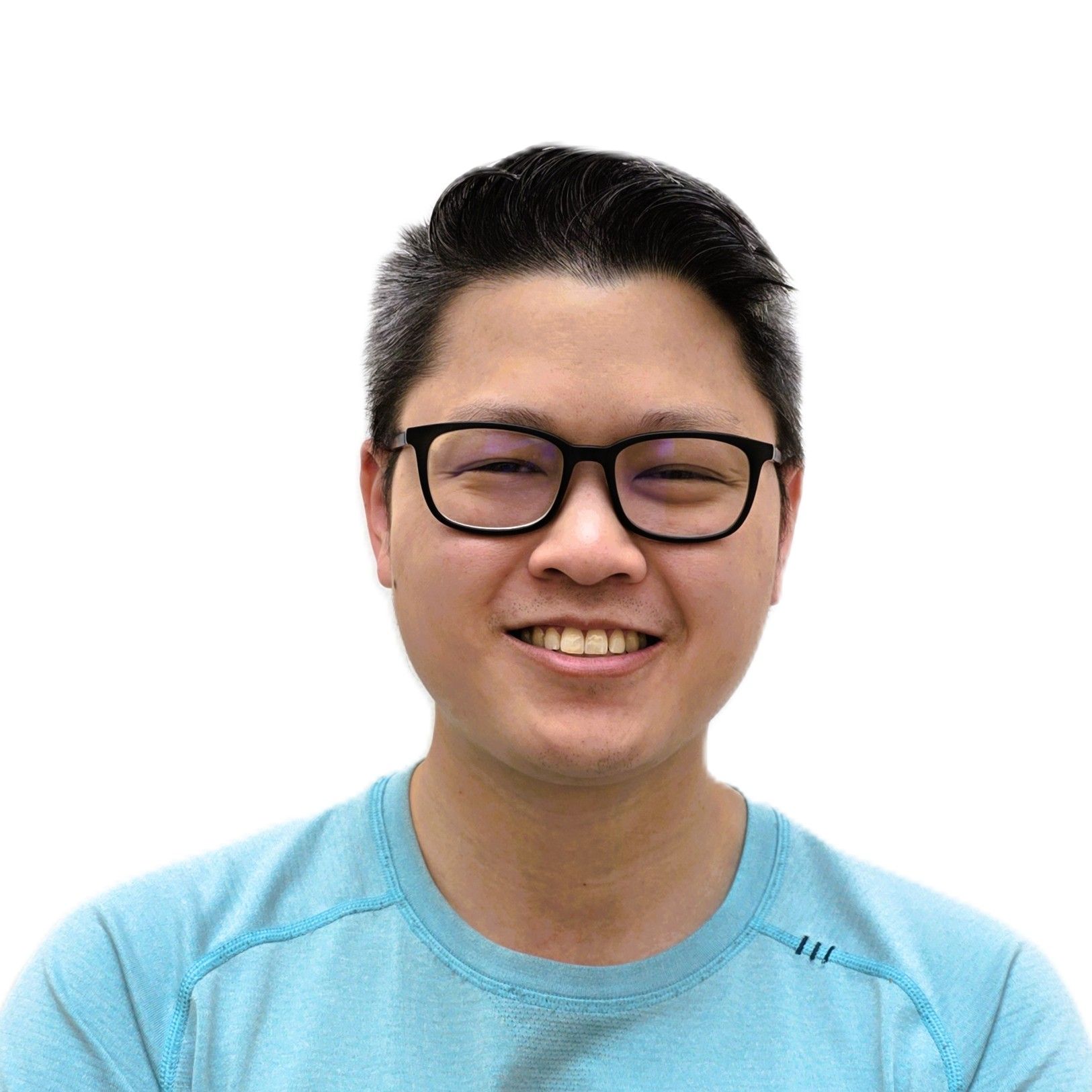 Smiling person wearing black glasses and a light blue shirt against a white background