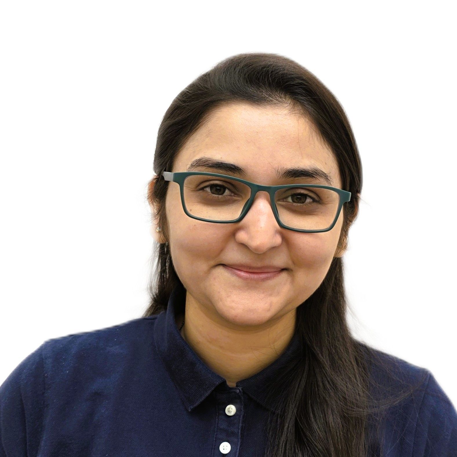Woman wearing glasses and a navy shirt, smiling against a white background
