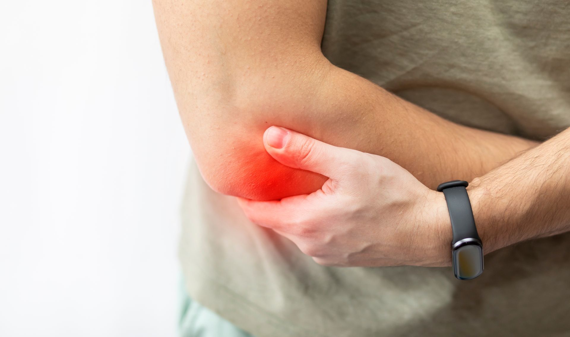 Person holding a painful elbow with a red glow indicating discomfort