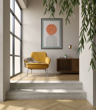 Modern living room with yellow chair, framed art, wood cabinet, and hanging plants in a bright sunlit space