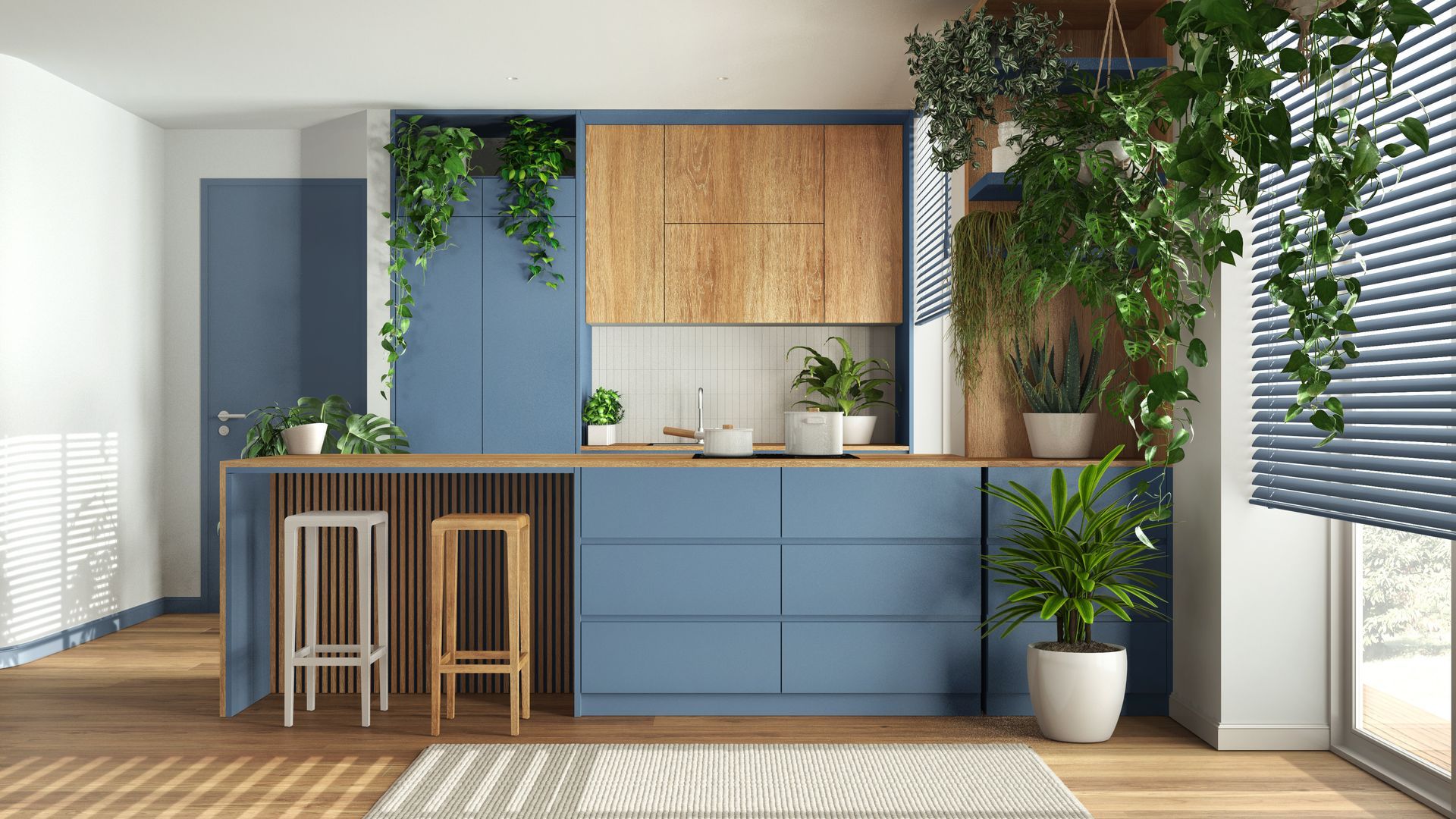 Modern kitchen with blue cabinets, wood accents, bar stools, and sunlight from large windows