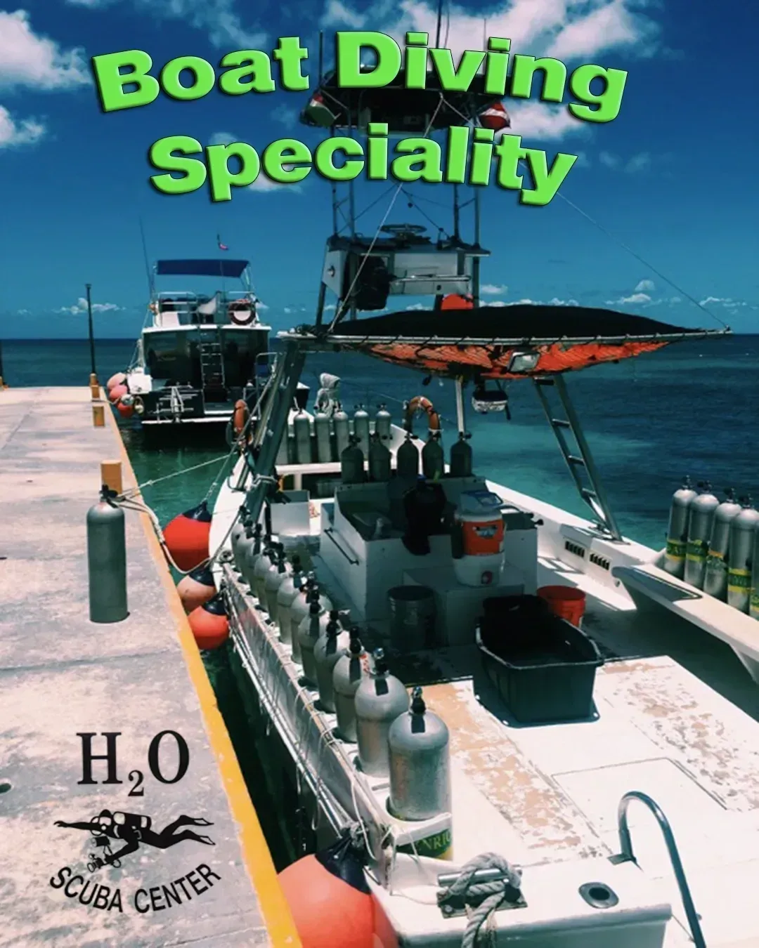 Boat Diving Specialty text over a docked dive boat and scuba tanks on a sunny ocean pier