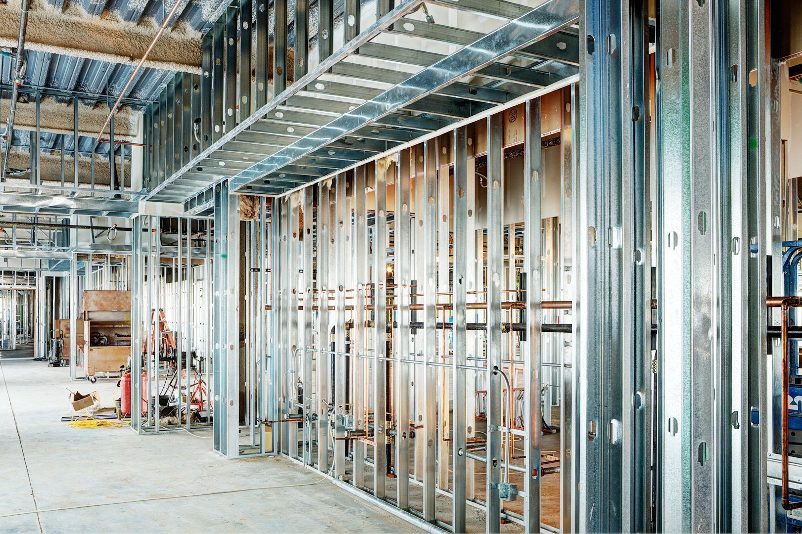 A building under construction with a lot of metal frames.