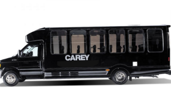 Black Carey passenger bus shown in side view on a white background