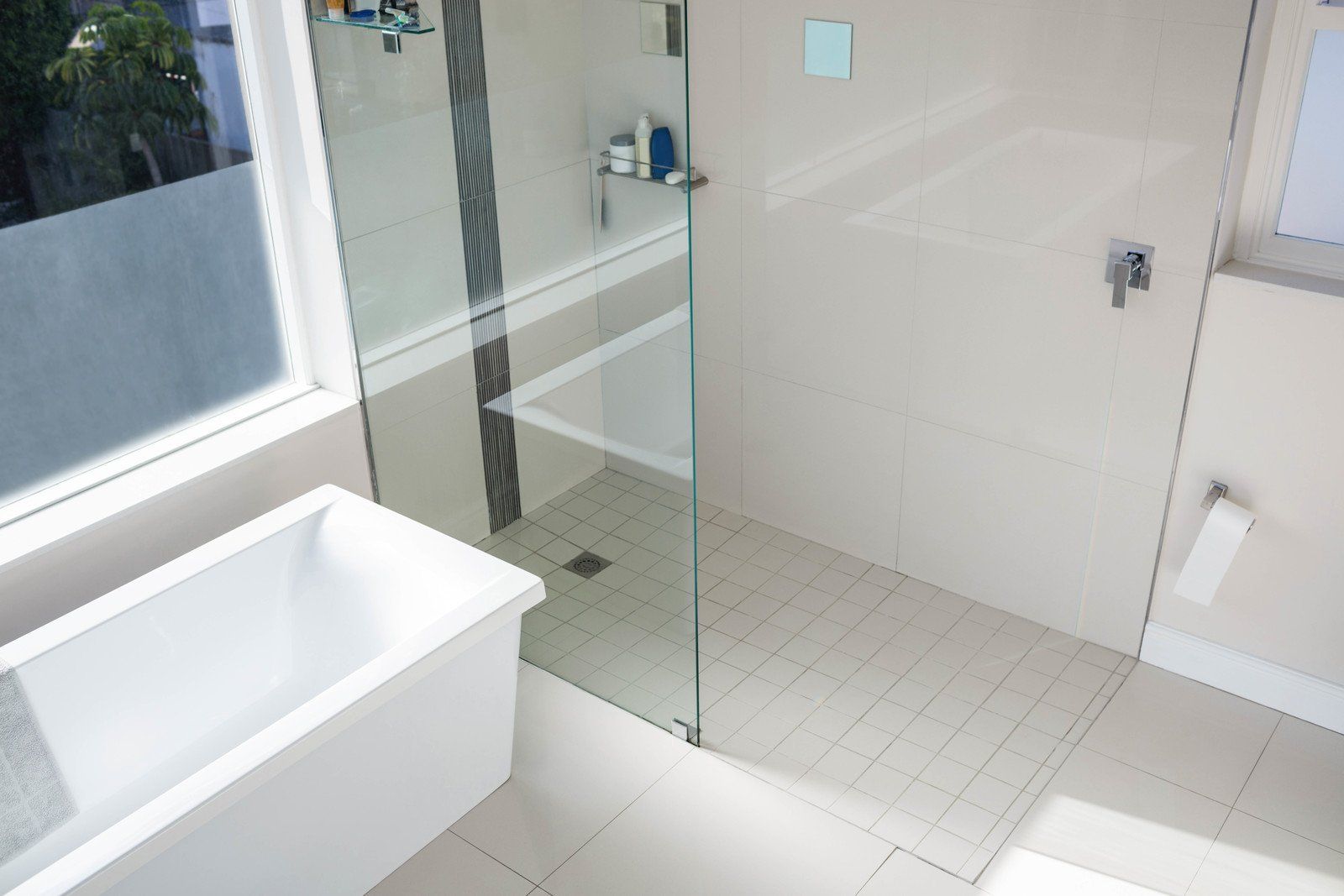 a glass panel on a bathroom