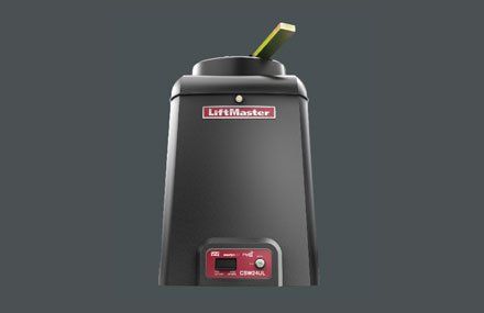 Black LiftMaster automatic gate opener with a raised arm, red control panel.