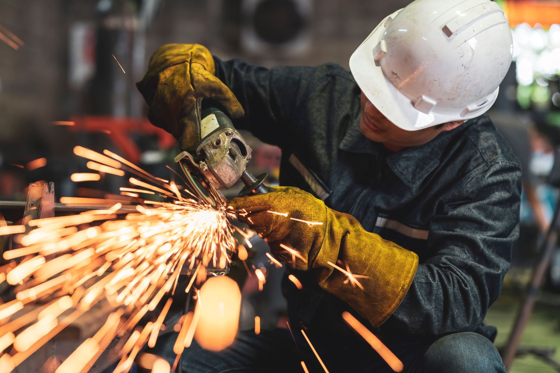 Professional welding services with safety gear and precision in industrial setting.