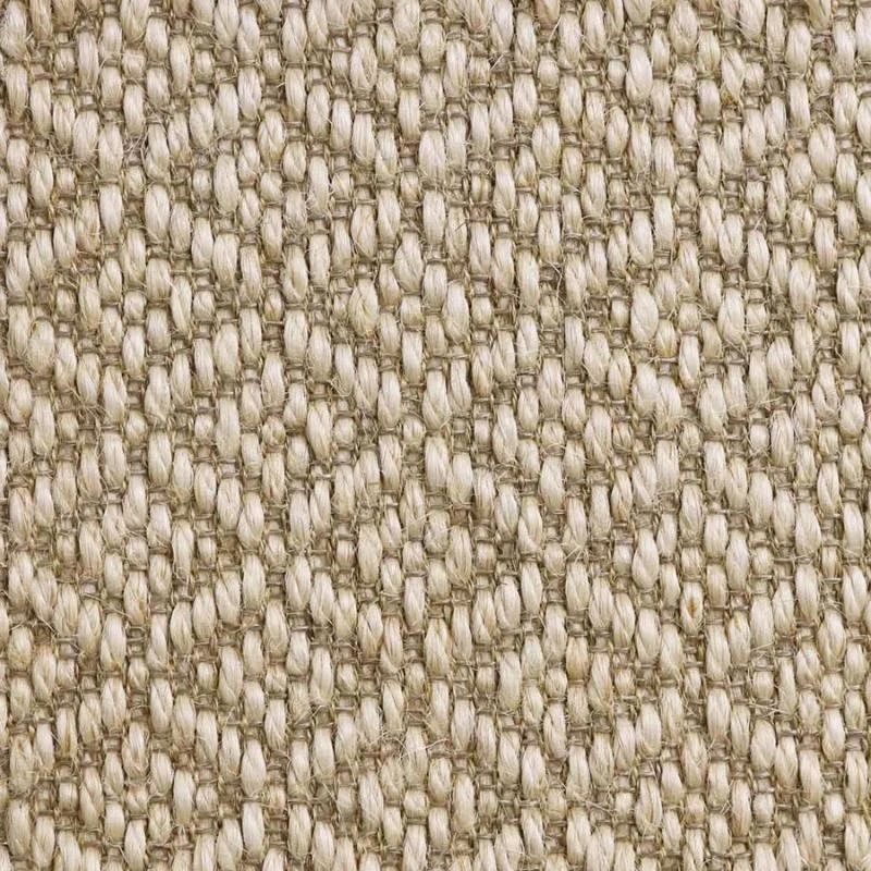 Close-up of a beige woven carpet with a textured, diamond-like pattern.