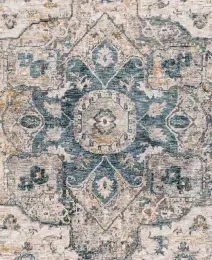 Beige and teal patterned area rug with an intricate central medallion design.