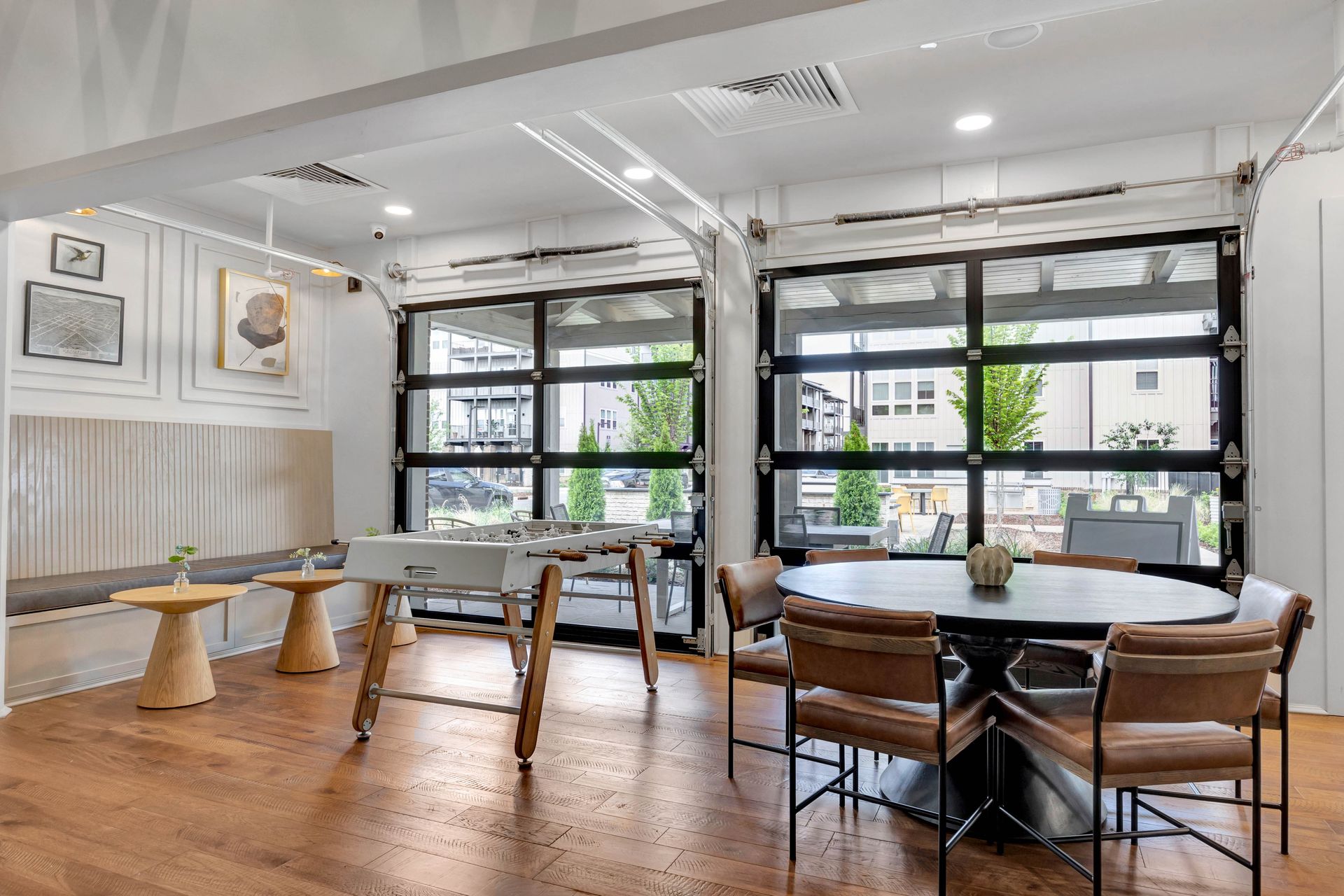 A kitchen with white cabinets , granite counter tops , stainless steel appliances and a large island.