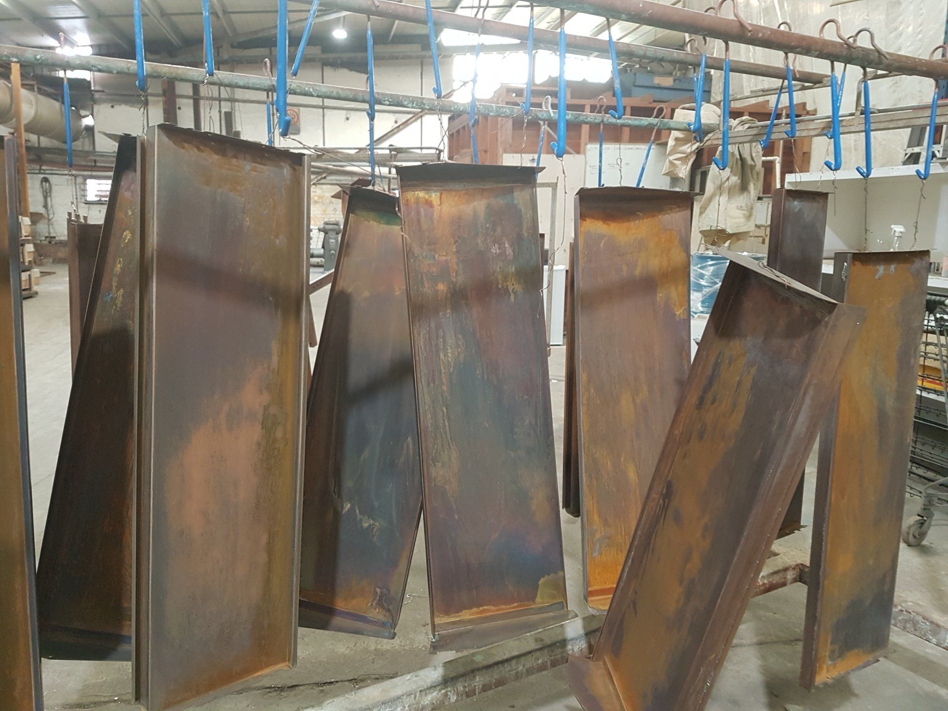 professional spraying chemical on metal