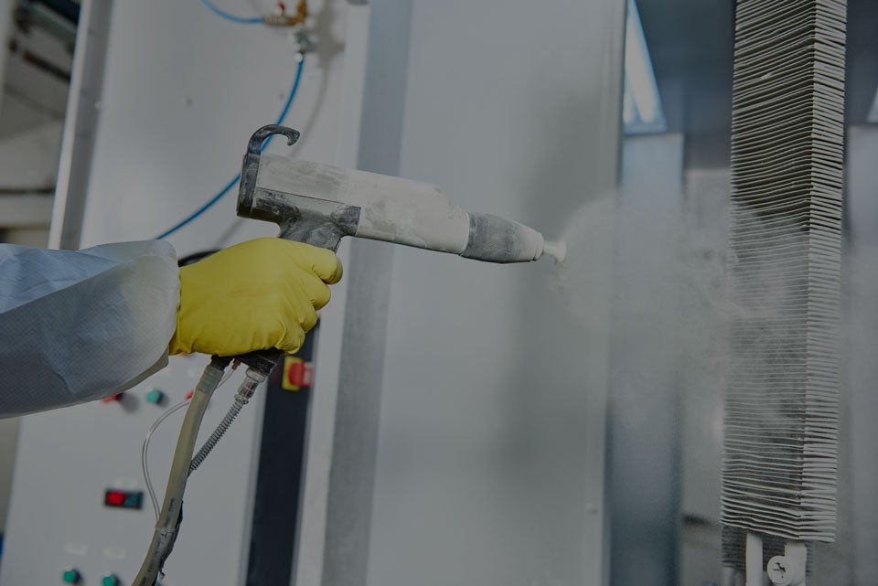 professional spraying chemical on metal