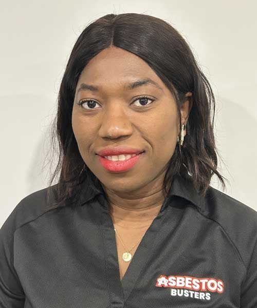 A woman is wearing a black shirt that says asbestos busters on it.