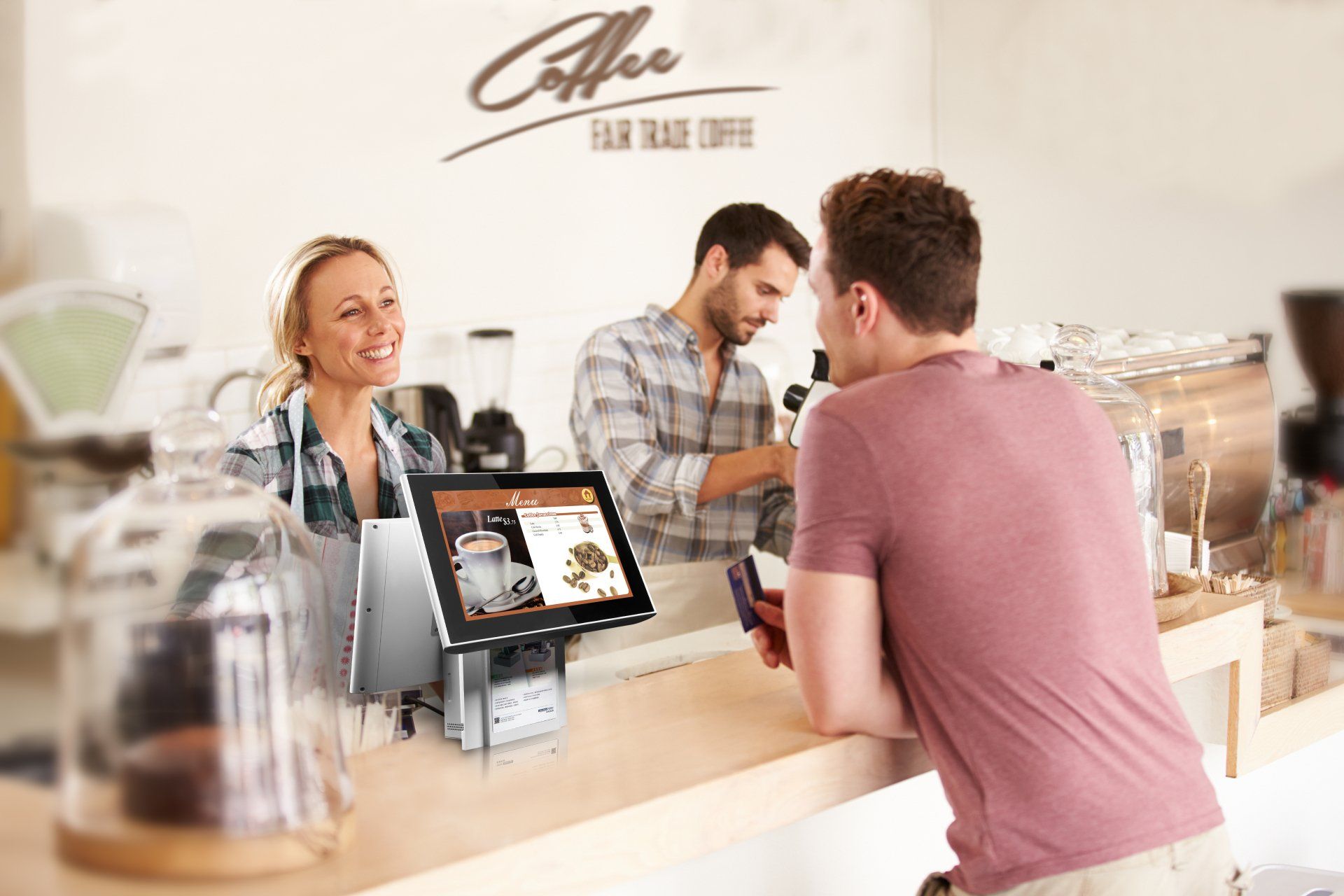man paying for his order in a cafe via a POS system