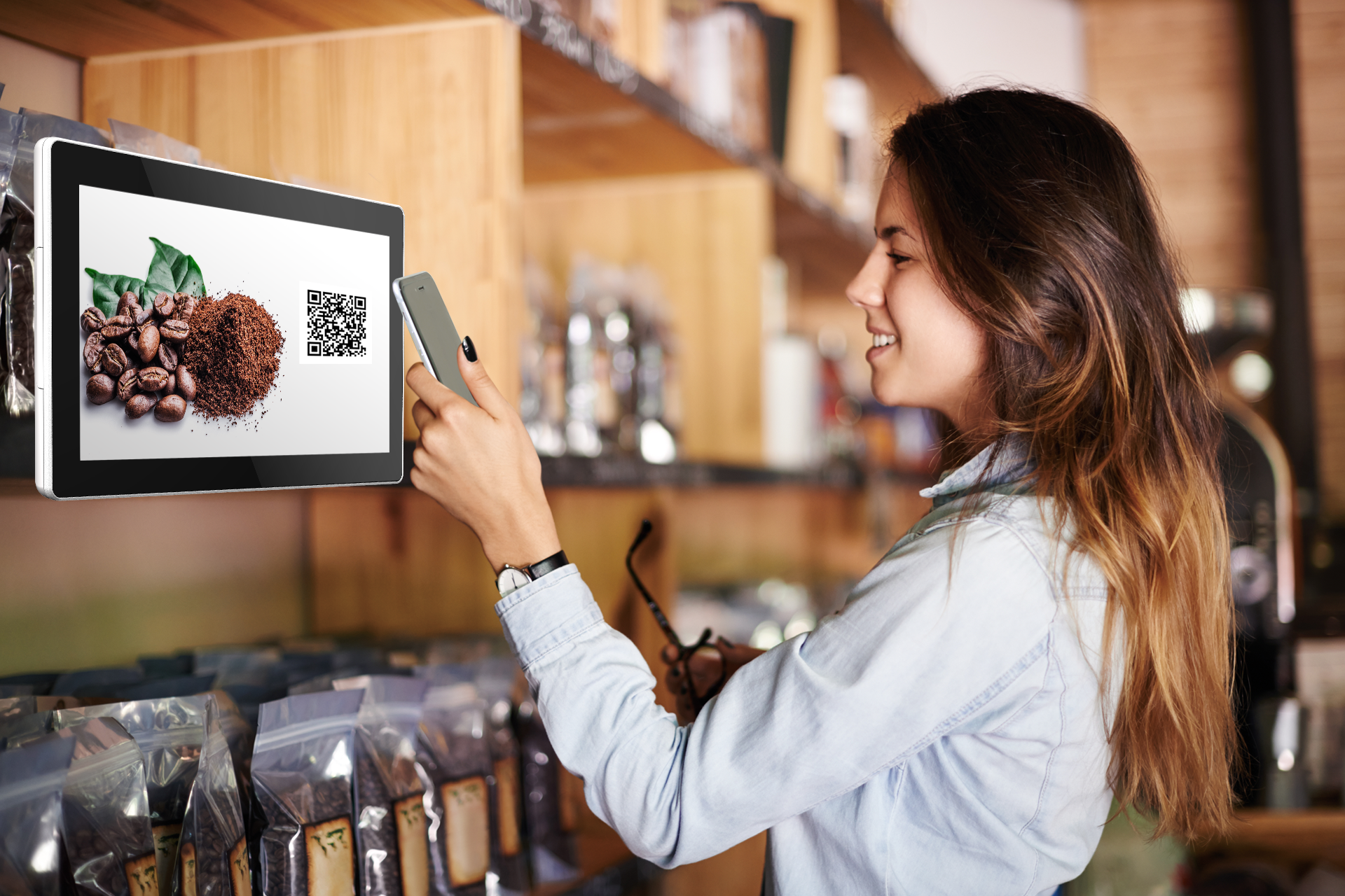 interactive digital signage - woman scanning QR code in a cafe