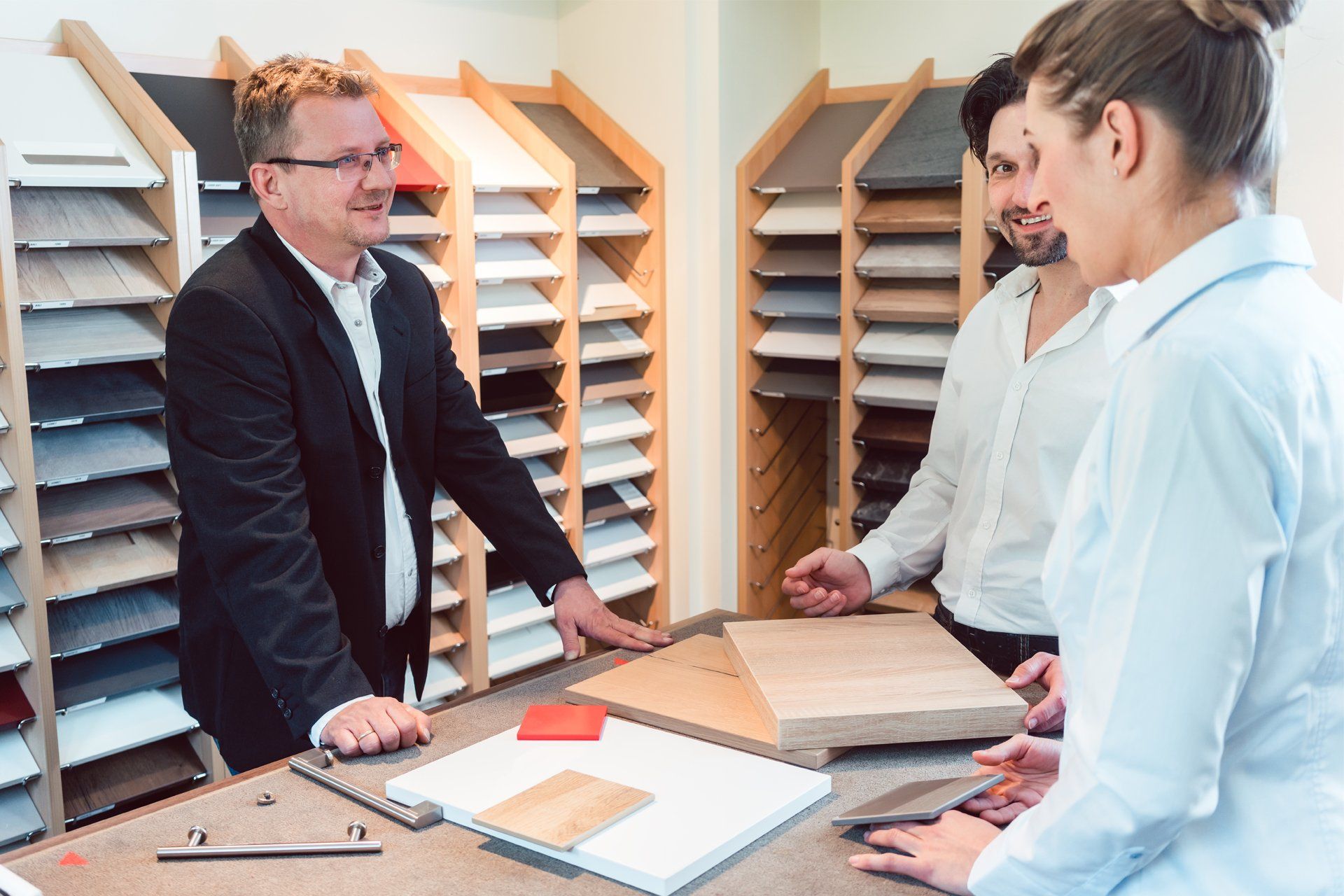 Salesman Explaining Options for Kitchen Materials