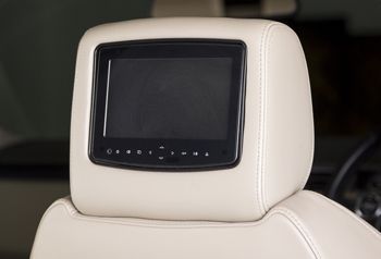 A boat with a steering wheel and a seat